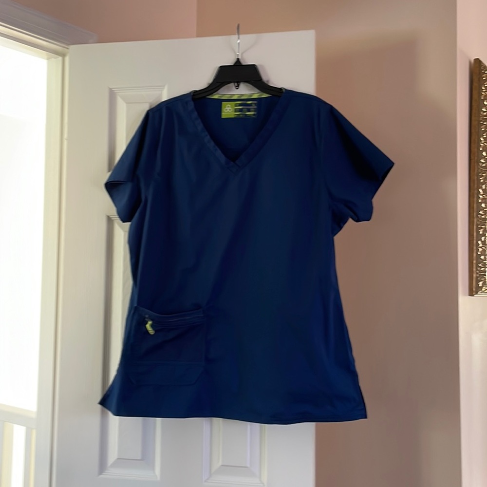 Navy scrub top size xl new without tag. By Antidote, front zipper pocket,